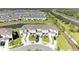 Aerial view of the townhome exterior, driveways, landscaping, and neighborhood at 5778 Windy Bay Ter, Nokomis, FL 34275