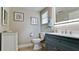 This bathroom features modern lighting, a gray cabinet, and white porcelain at 5802 De Palmas Ave, Holmes Beach, FL 34217