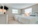 Bright bedroom with two twin beds, decorative pillows and plenty of natural light creates a comfortable, inviting space at 5802 De Palmas Ave, Holmes Beach, FL 34217