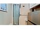 Efficient laundry area equipped with modern stacked washer and dryer units, maximizing space and convenience at 5802 De Palmas Ave, Holmes Beach, FL 34217