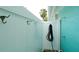 Outdoor shower area with a privacy wall and convenient hooks, perfect for rinsing off after beach visits at 5802 De Palmas Ave, Holmes Beach, FL 34217