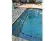 Close-up of a stunning pool showcasing tile detailing, crystal-clear water, and a serene, inviting ambiance at 5802 De Palmas Ave, Holmes Beach, FL 34217
