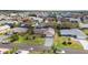 Neighborhood aerial shot showcasing well-maintained homes, green spaces, and neatly paved streets at 5859 Lincoln Rd, Venice, FL 34293