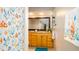 Bathroom featuring a vanity with a large mirror, colorful shower curtain, and blue rug at 5859 Lincoln Rd, Venice, FL 34293