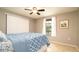 Comfortable bedroom featuring tile floors, a window with view, and closet doors at 5859 Lincoln Rd, Venice, FL 34293