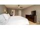 Comfortable bedroom featuring tile flooring, closet space, and neutral wall paint at 5859 Lincoln Rd, Venice, FL 34293
