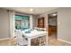 Cozy dining room featuring white furniture and access to the screened patio at 5859 Lincoln Rd, Venice, FL 34293
