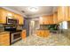 Well-appointed kitchen with stainless appliances and ample counter space at 5859 Lincoln Rd, Venice, FL 34293