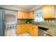 Functional kitchen with light cabinets and stainless steel appliances at 5859 Lincoln Rd, Venice, FL 34293
