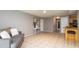 Cozy living area featuring an open floor plan, tile flooring, and neutral paint at 5859 Lincoln Rd, Venice, FL 34293