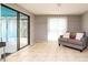 Open living area featuring tile floors, slider to lanai, neutral walls, and a ceiling fan at 5859 Lincoln Rd, Venice, FL 34293