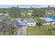 Aerial view of a residential community showcasing the well-kept lawns and mature trees at 5869 Tidewood Ave # 7, Sarasota, FL 34231