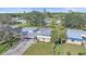 Charming single-story home with a carport surrounded by lush landscaping and well-maintained lawn at 5869 Tidewood Ave # 7, Sarasota, FL 34231