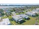 An aerial view of a neighborhood showcases the well-maintained landscaping and waterfront homes at 5869 Tidewood Ave # 7, Sarasota, FL 34231