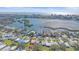 Beautiful aerial view of a neighborhood, showcasing the river and picturesque city skyline in the distance at 5869 Tidewood Ave # 7, Sarasota, FL 34231
