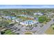 Community clubhouse featuring a sparkling pool and meticulously maintained grounds at 5869 Tidewood Ave # 7, Sarasota, FL 34231