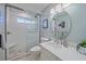 Modern bathroom featuring a glass shower, pebble flooring, and stylish fixtures at 5869 Tidewood Ave # 7, Sarasota, FL 34231
