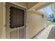Charming entrance with a decorative door and a pathway lined with decorative stones at 5869 Tidewood Ave # 7, Sarasota, FL 34231