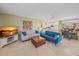 Inviting living room featuring comfortable seating, stylish decor, and an open layout to the kitchen at 5869 Tidewood Ave # 7, Sarasota, FL 34231