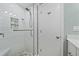 This shower features white subway tiles, a rain-style shower head, and a built-in soap dish at 5869 Tidewood Ave # 7, Sarasota, FL 34231