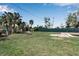 Large grassy backyard with mature trees at 605 15Th Avenue E Dr, Palmetto, FL 34221