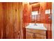 Bathroom with wood paneling and a vanity sink at 605 15Th Avenue E Dr, Palmetto, FL 34221