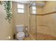 Comfortable bathroom includes a convenient toilet and tiled shower with a glass door at 605 15Th Avenue E Dr, Palmetto, FL 34221