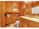 Bathroom with wood paneling, vanity, and updated fixtures at 605 15Th Avenue E Dr, Palmetto, FL 34221