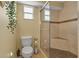 Cozy bathroom includes a convenient toilet and tiled shower with a glass door at 605 15Th Avenue E Dr, Palmetto, FL 34221