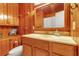 Bathroom with wood paneling, vanity, and updated fixtures at 605 15Th Avenue E Dr, Palmetto, FL 34221