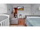 Bedroom with wood paneling and a comfortable seating area at 605 15Th Avenue E Dr, Palmetto, FL 34221