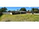 Charming single-story home featuring a well-maintained lawn and a partially bricked facade at 605 15Th Avenue E Dr, Palmetto, FL 34221