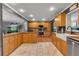 Spacious kitchen featuring granite countertops, stainless steel appliances, and a farmhouse sink at 605 15Th Avenue E Dr, Palmetto, FL 34221