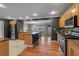 Spacious kitchen with stainless steel appliances, wooden cabinets, granite countertop, and island at 605 15Th Avenue E Dr, Palmetto, FL 34221