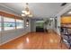 Spacious living room with hardwood floors, neutral paint, and large windows allowing natural light at 605 15Th Avenue E Dr, Palmetto, FL 34221