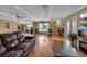 Inviting living room with hardwood floors, comfortable seating, and a bright, airy feel at 605 15Th Avenue E Dr, Palmetto, FL 34221