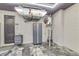 Clean garage featuring epoxy floor, storage cabinet, and utility equipment at 7016 Brier Creek Ct, Lakewood Ranch, FL 34202
