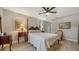 Cozy bedroom features a four-poster bed, soft lighting, and stylish decor for comfortable living at 7347 Royal Birkdale Dr, Sarasota, FL 34238
