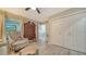 Inviting bedroom with a large window, closet, and stylish furnishings for comfortable living at 7347 Royal Birkdale Dr, Sarasota, FL 34238