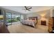 Inviting bedroom with sliding glass doors leading to a patio and a comfortable king-size bed at 7347 Royal Birkdale Dr, Sarasota, FL 34238