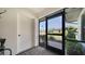 Home entrance with a screened door and an elegant patterned floor mat at 7347 Royal Birkdale Dr, Sarasota, FL 34238
