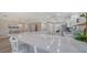 Open kitchen with marble countertop island and dining area, creating an inviting space for meal preparation and entertaining at 7347 Royal Birkdale Dr, Sarasota, FL 34238