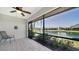 Relax on this tiled lanai with water views, offering a serene and inviting outdoor space at 7347 Royal Birkdale Dr, Sarasota, FL 34238