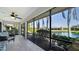 Enjoy waterfront living from this screened lanai with tile flooring and scenic views of the pond at 7347 Royal Birkdale Dr, Sarasota, FL 34238