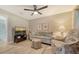 Cozy sitting room features a comfortable sofa and chair, with a TV for relaxing evenings at 7347 Royal Birkdale Dr, Sarasota, FL 34238