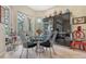 Stylish breakfast nook with modern table and chairs, alongside a decorative hutch at 7432 Ascot Ct, University Park, FL 34201