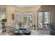Cozy breakfast nook with a round glass table, stylish chairs, and scenic outdoor view at 7432 Ascot Ct, University Park, FL 34201