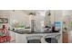 Well-appointed kitchen featuring sleek black countertops, white cabinetry, and modern appliances at 7432 Ascot Ct, University Park, FL 34201