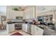 Kitchen with stainless steel appliances, ample counter space, and a view to the dining room at 7432 Ascot Ct, University Park, FL 34201