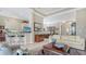 Comfortable living room with seamless transition to kitchen and dining, perfect for modern living at 7432 Ascot Ct, University Park, FL 34201